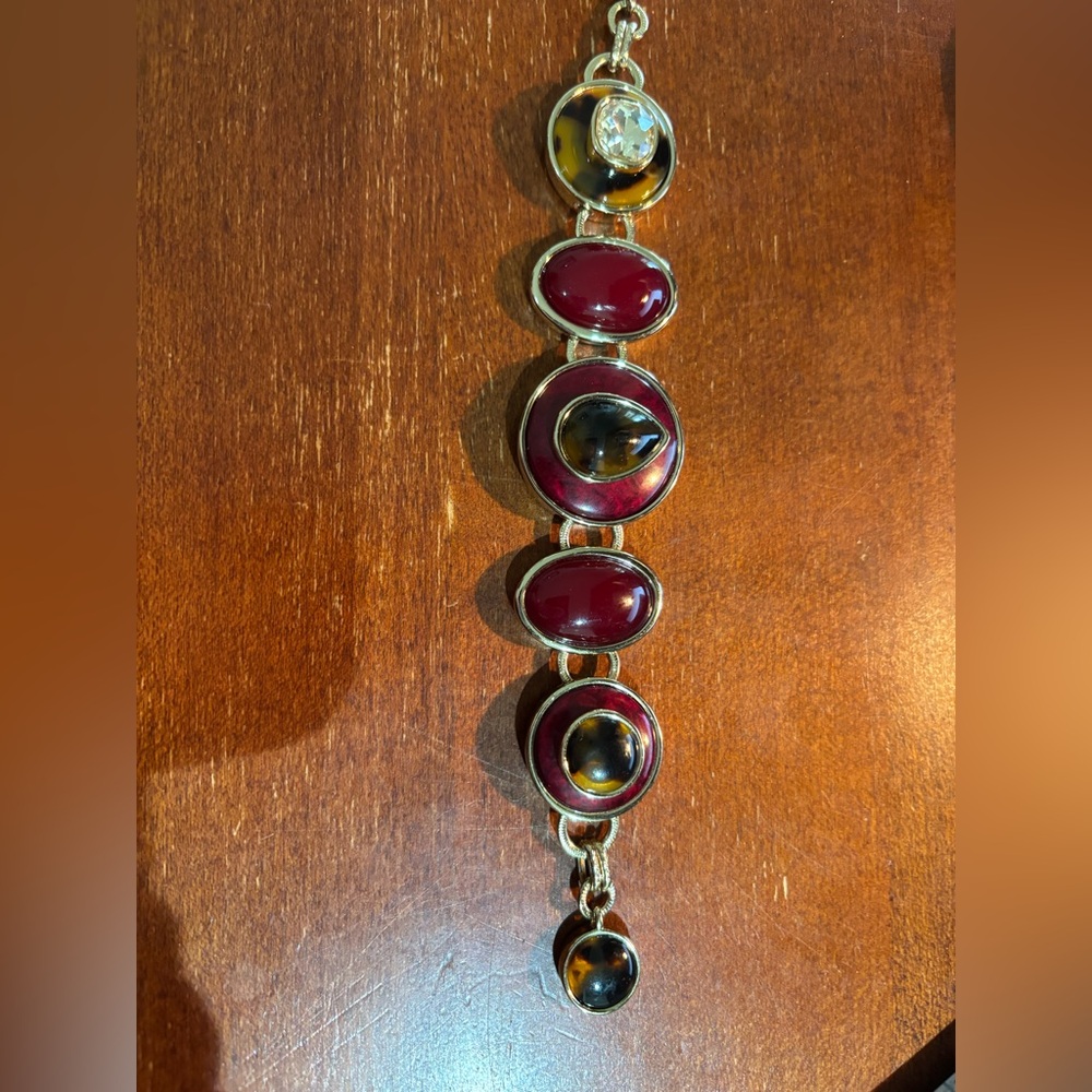 Beautiful Chico’s maroon, animal printt and gold bracelet let. No signs of wear